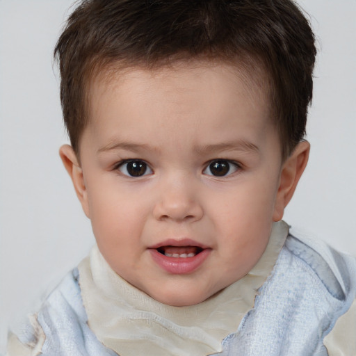 Joyful white child male with short  brown hair and brown eyes