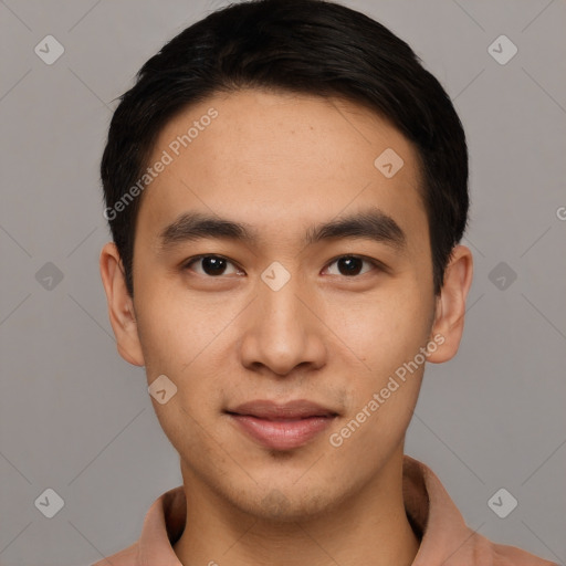 Joyful asian young-adult male with short  black hair and brown eyes