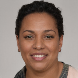 Joyful white adult female with short  brown hair and brown eyes