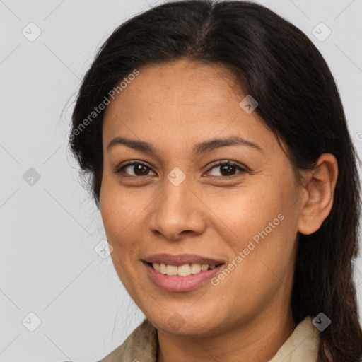 Joyful latino adult female with medium  brown hair and brown eyes