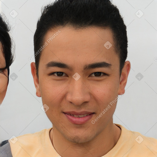 Joyful asian young-adult male with short  brown hair and brown eyes