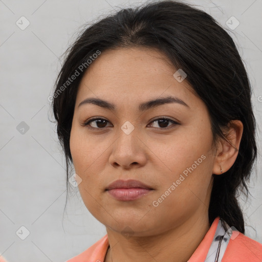 Joyful asian young-adult female with medium  brown hair and brown eyes