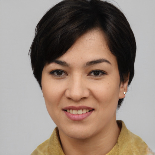 Joyful asian young-adult female with medium  black hair and brown eyes