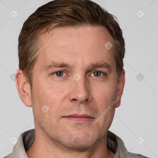 Neutral white adult male with short  brown hair and grey eyes