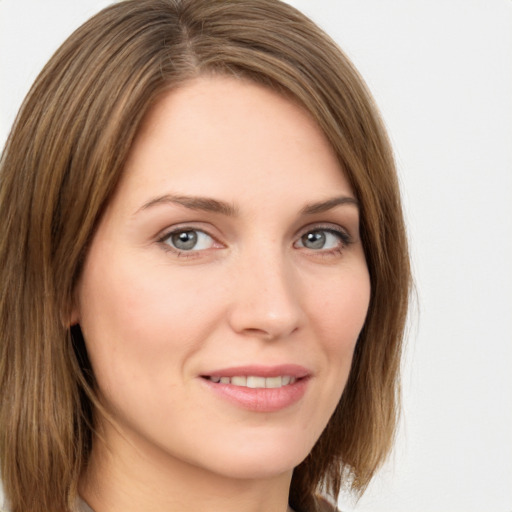 Joyful white young-adult female with medium  brown hair and green eyes