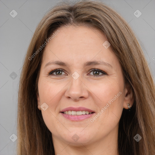 Joyful white adult female with long  brown hair and brown eyes