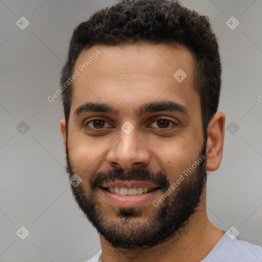 Joyful white young-adult male with short  black hair and brown eyes