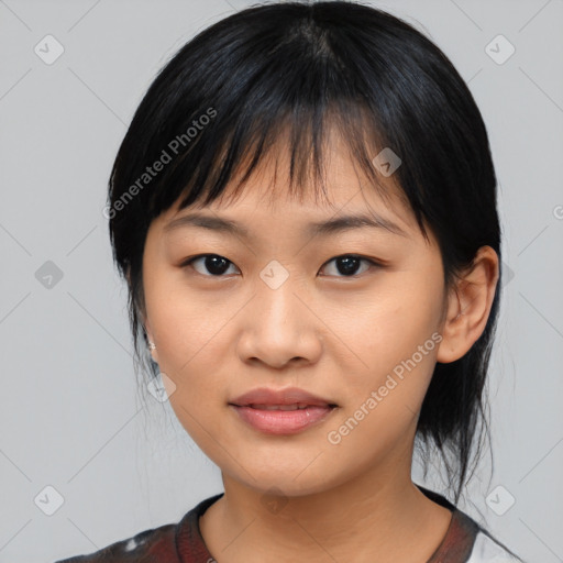 Joyful asian young-adult female with medium  black hair and brown eyes