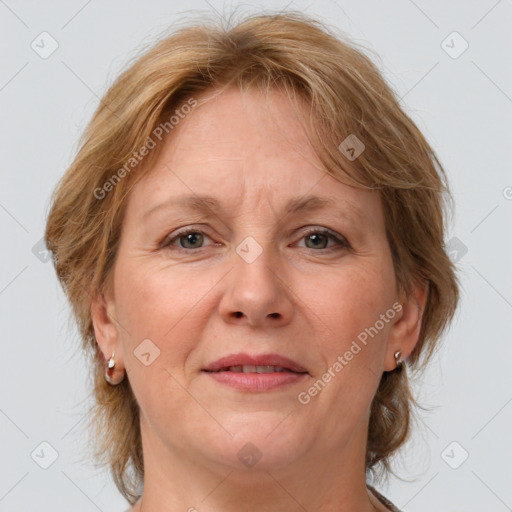 Joyful white adult female with medium  brown hair and grey eyes