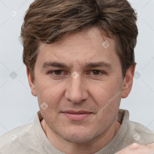 Joyful white adult male with short  brown hair and grey eyes