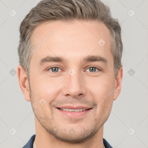 Joyful white young-adult male with short  brown hair and brown eyes