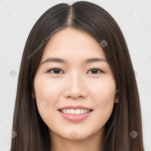 Joyful asian young-adult female with long  brown hair and brown eyes