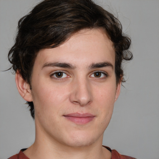 Joyful white young-adult male with medium  brown hair and brown eyes