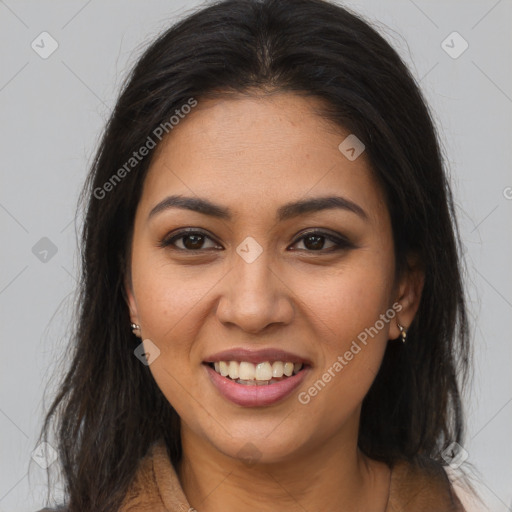 Joyful latino young-adult female with long  brown hair and brown eyes