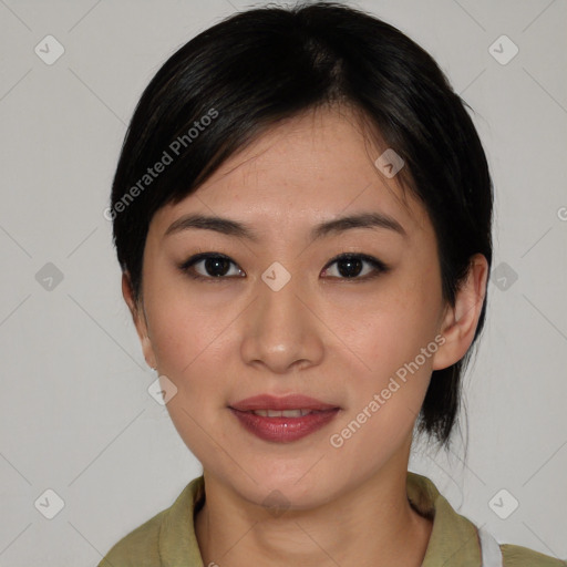 Joyful asian young-adult female with medium  black hair and brown eyes