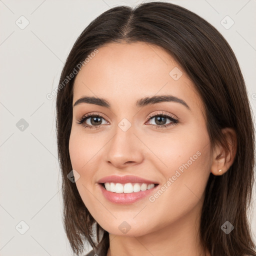 Joyful white young-adult female with long  brown hair and brown eyes