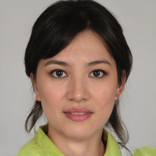 Joyful white young-adult female with medium  brown hair and brown eyes