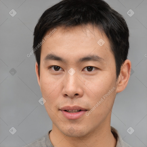 Neutral asian young-adult male with short  brown hair and brown eyes