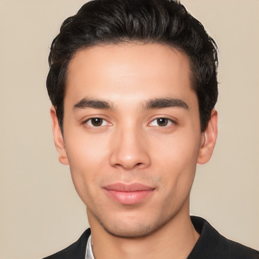 Joyful white young-adult male with short  black hair and brown eyes