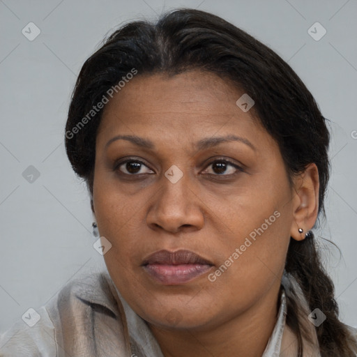 Joyful black adult female with medium  brown hair and brown eyes