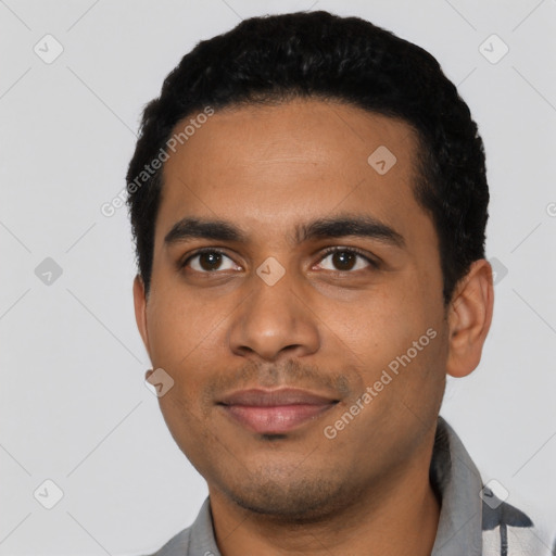 Joyful latino young-adult male with short  black hair and brown eyes