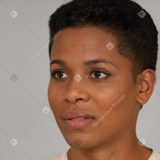 Joyful black young-adult female with short  black hair and brown eyes