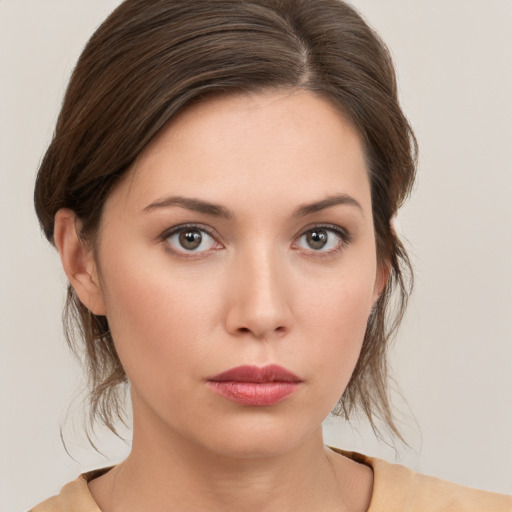 Neutral white young-adult female with medium  brown hair and brown eyes