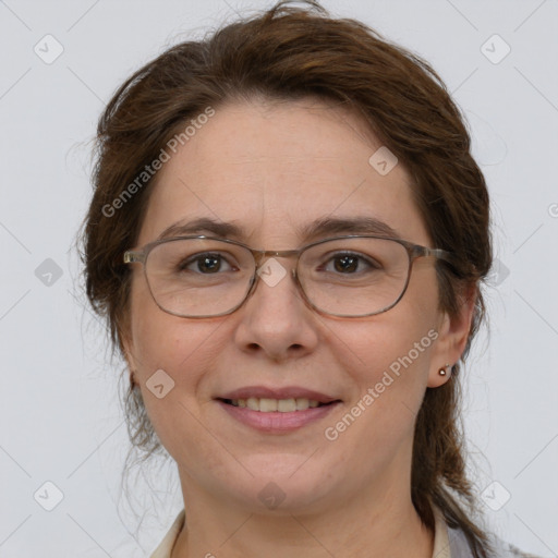 Joyful white adult female with medium  brown hair and grey eyes