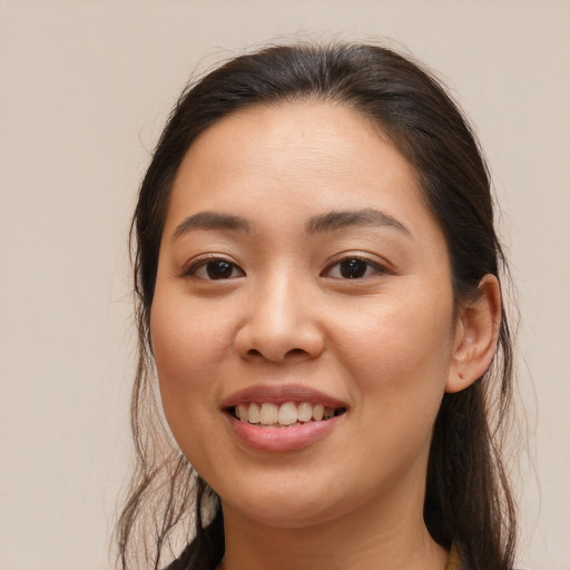 Joyful white young-adult female with medium  brown hair and brown eyes