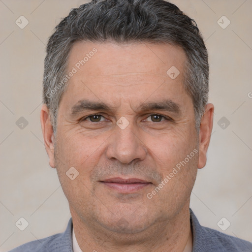 Joyful white adult male with short  black hair and brown eyes