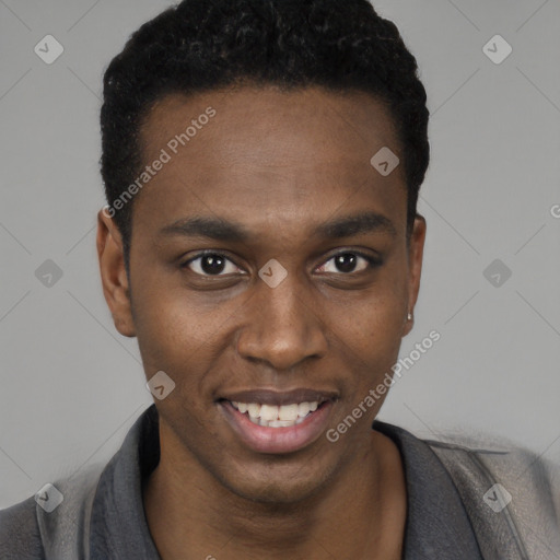 Joyful black young-adult male with short  black hair and brown eyes