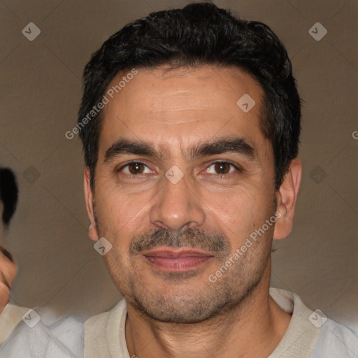 Joyful white adult male with short  black hair and brown eyes