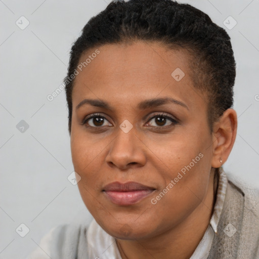 Joyful black young-adult female with short  brown hair and brown eyes