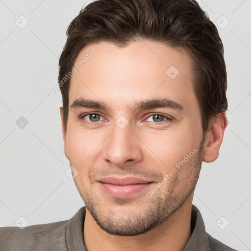 Joyful white young-adult male with short  brown hair and brown eyes