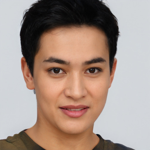 Joyful latino young-adult male with short  brown hair and brown eyes