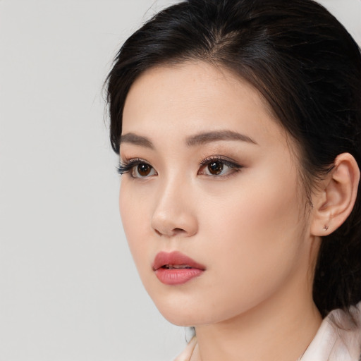 Neutral asian young-adult female with medium  brown hair and brown eyes