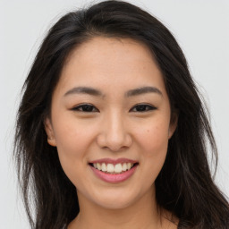 Joyful asian young-adult female with long  brown hair and brown eyes