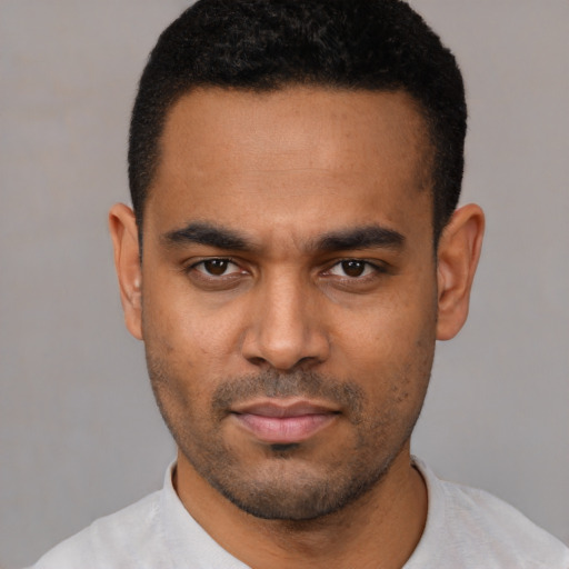 Neutral latino young-adult male with short  black hair and brown eyes