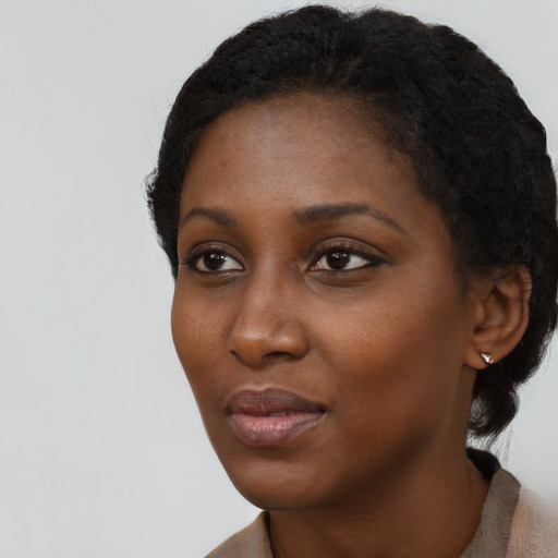 Neutral black young-adult female with short  black hair and brown eyes