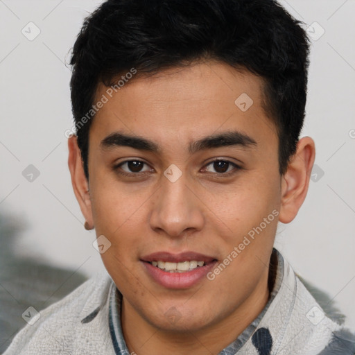 Joyful latino young-adult male with short  brown hair and brown eyes