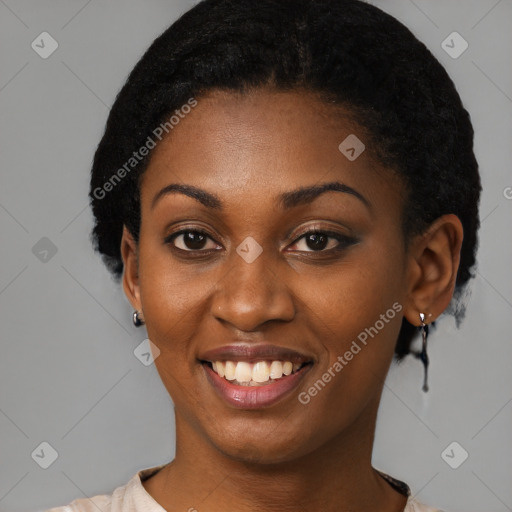 Joyful black young-adult female with short  black hair and brown eyes