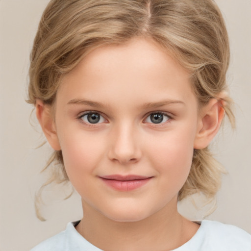 Joyful white child female with medium  brown hair and brown eyes