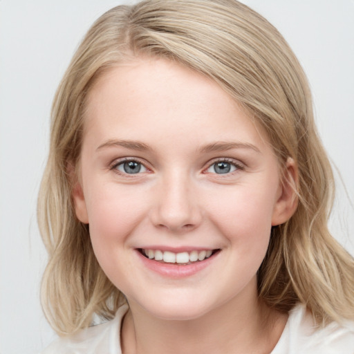 Joyful white young-adult female with medium  brown hair and blue eyes