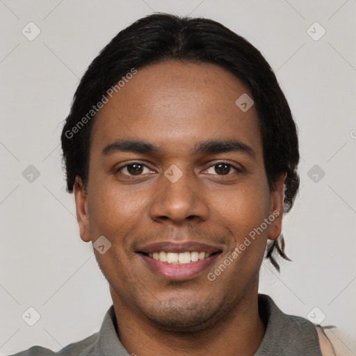 Joyful black young-adult male with short  black hair and brown eyes