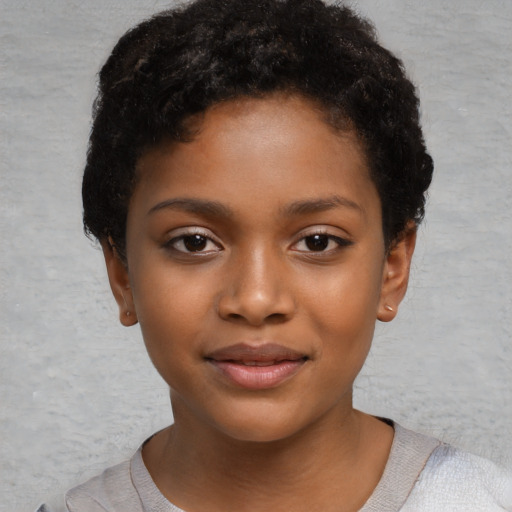 Joyful black child female with short  brown hair and brown eyes