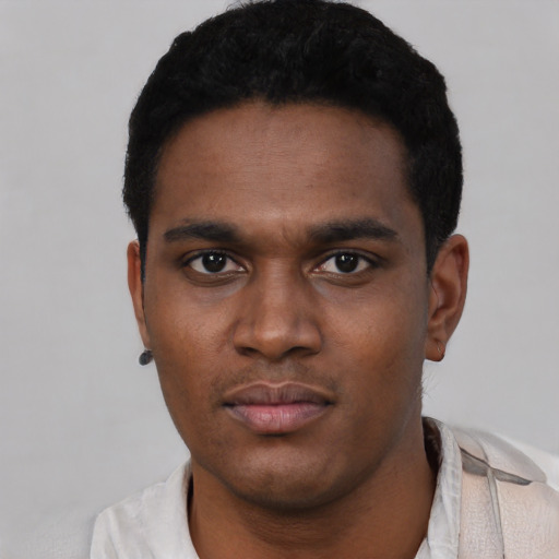 Neutral black young-adult male with short  black hair and brown eyes