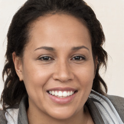 Joyful white adult female with medium  brown hair and brown eyes