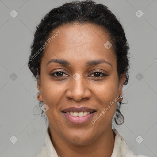 Joyful black adult female with short  brown hair and brown eyes