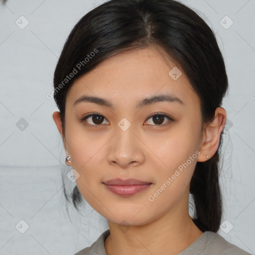 Joyful asian young-adult female with medium  black hair and brown eyes