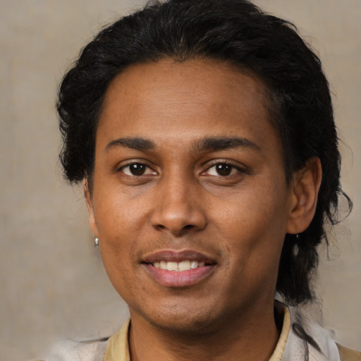 Joyful latino young-adult female with short  brown hair and brown eyes